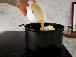 adding vegetables stock for soup