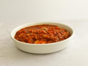 chicken with tomato sauce is ready to bake