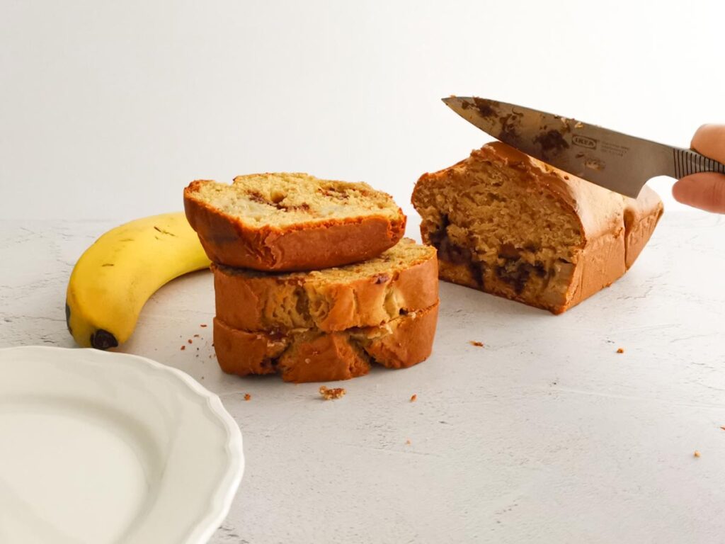 cutting banana bread loaf