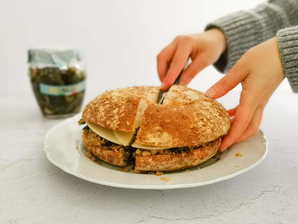 cutting sausage sandwich in half