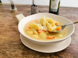 eating cauliflower soup with gnocchi