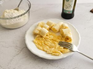 mashing banana with a fork