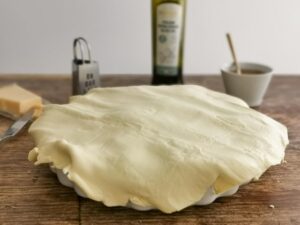 covering pie with pastry