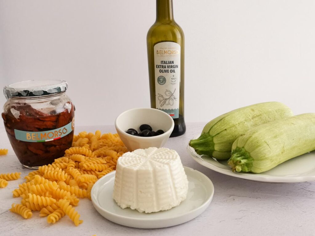 ingredients for summer pasta with zucchini ricotta and basil