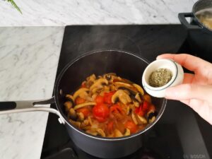 adding thyme for tomato mushrooms sauce