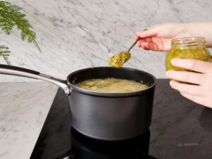 adding cream of asparagus to green pea risotto