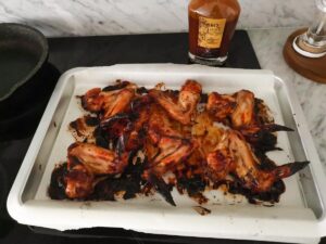 chicken wings with BBQ sauce out of the oven