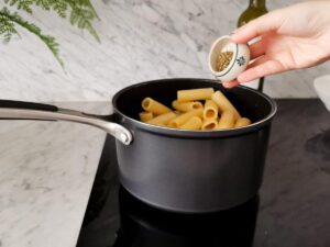 seasoning pasta with oregano