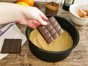 adding dark chocolate to cake batter