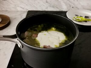 adding cream to italian sausage soup