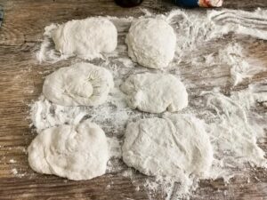 flour each small ciabatta dough on both sides