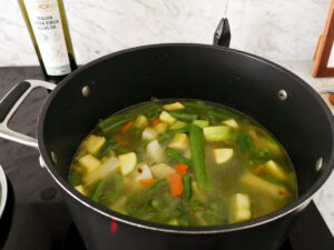 simmering minestrone with pesto