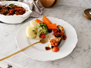 serving baked swordfish with steamed vegetables