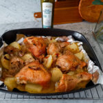 baked chicken legs with potatoes and onions