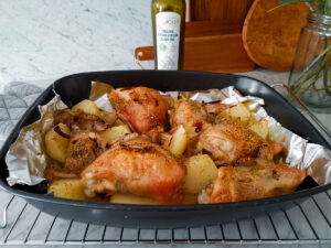 baked chicken legs with potatoes and onions