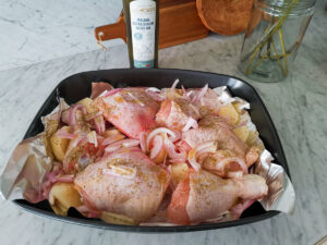 baked chicken legs with potatoes and onions