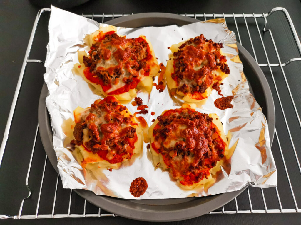 Parmesan smashed potatoes with Mascarpone sauce 