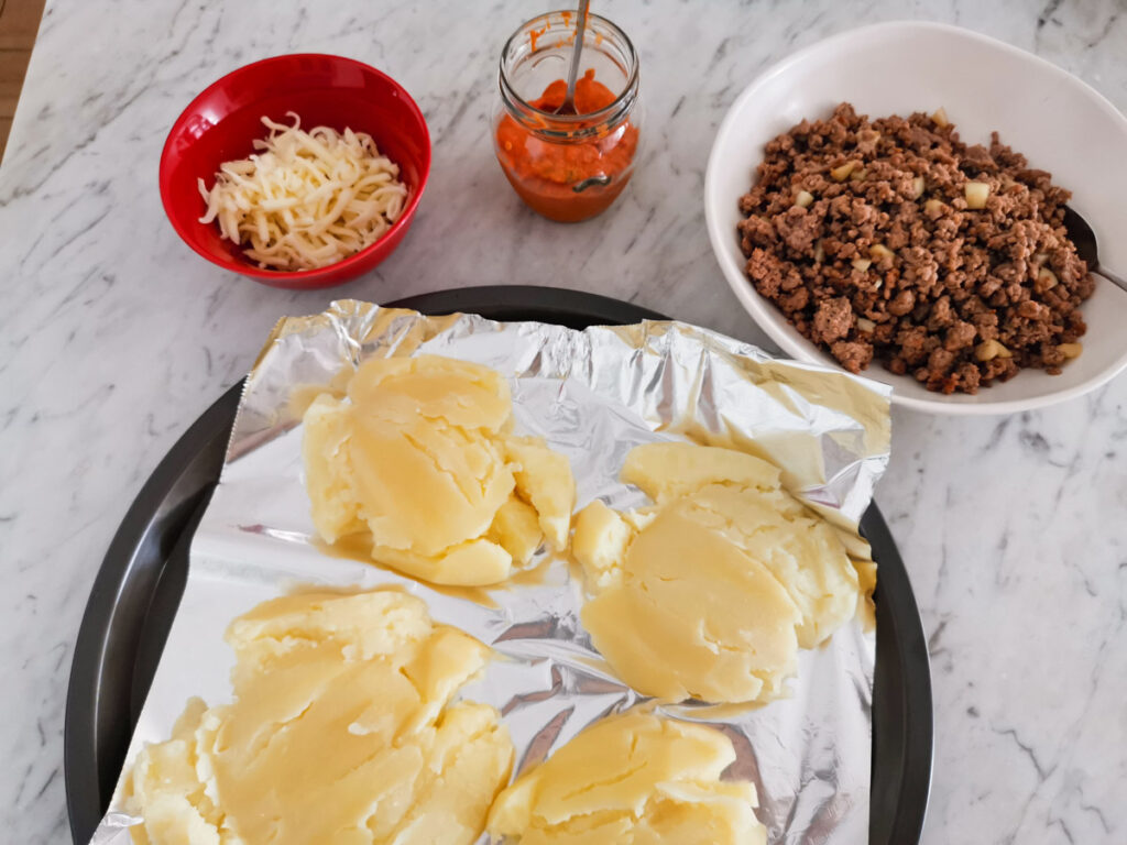 Parmesan smashed potatoes with Mascarpone sauce 