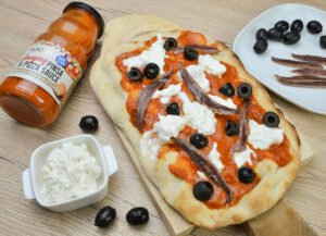pinsa with anchovies tomato pecorino and stracciatella