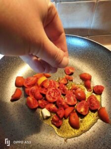 Spinach leaves pasta with salmon and courgettes