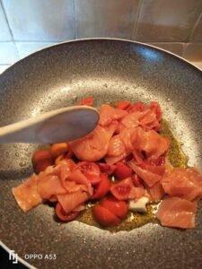 Spinach leaves pasta with salmon and courgettes
